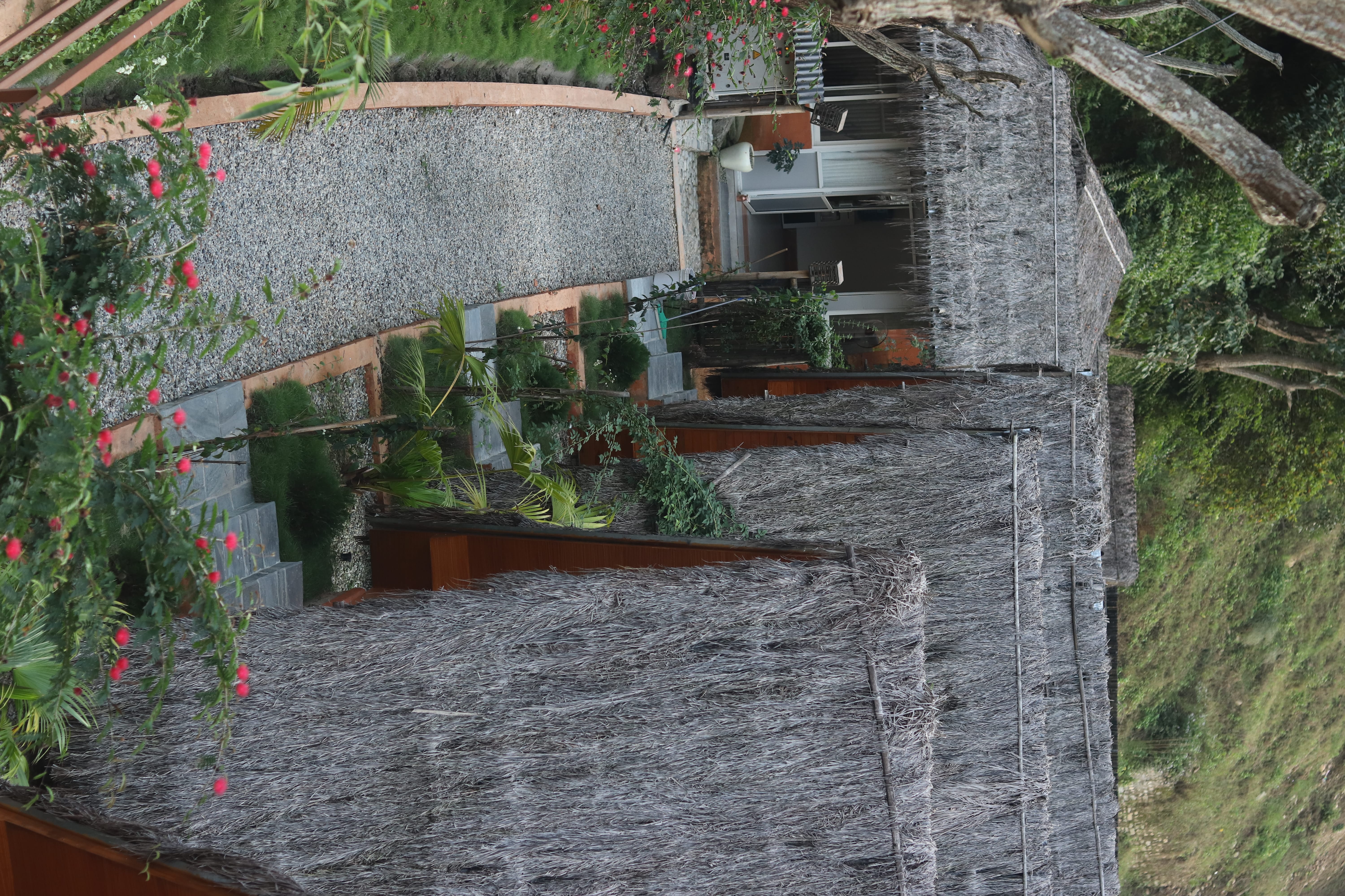 Garden pathway between Bamboo Cottages at Triangles Resort